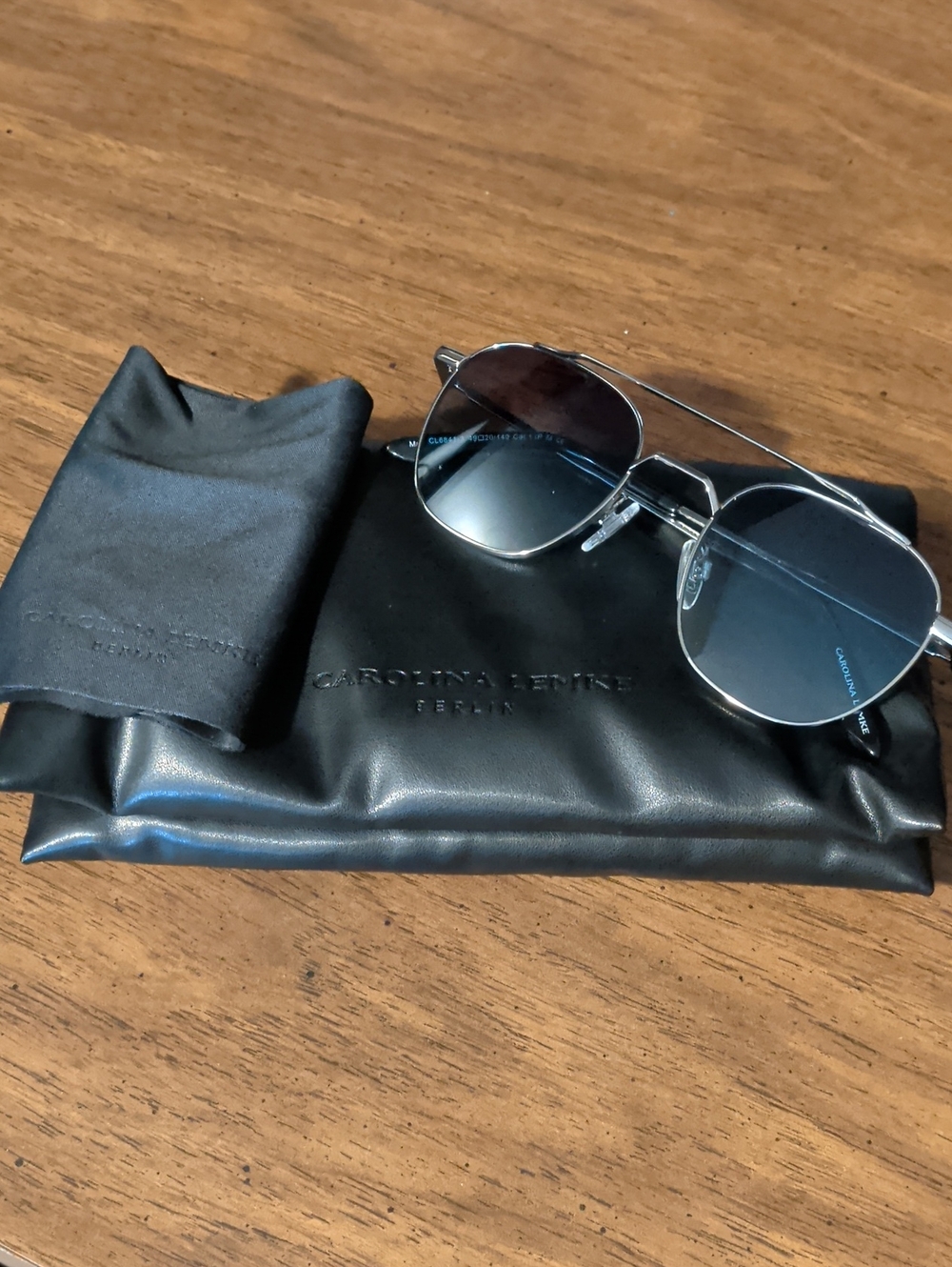 Carolina Lemke Berlin Men’s Silver Frame Sunglasses with Blue Lenses